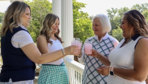 Guests sharing a toast on the porch