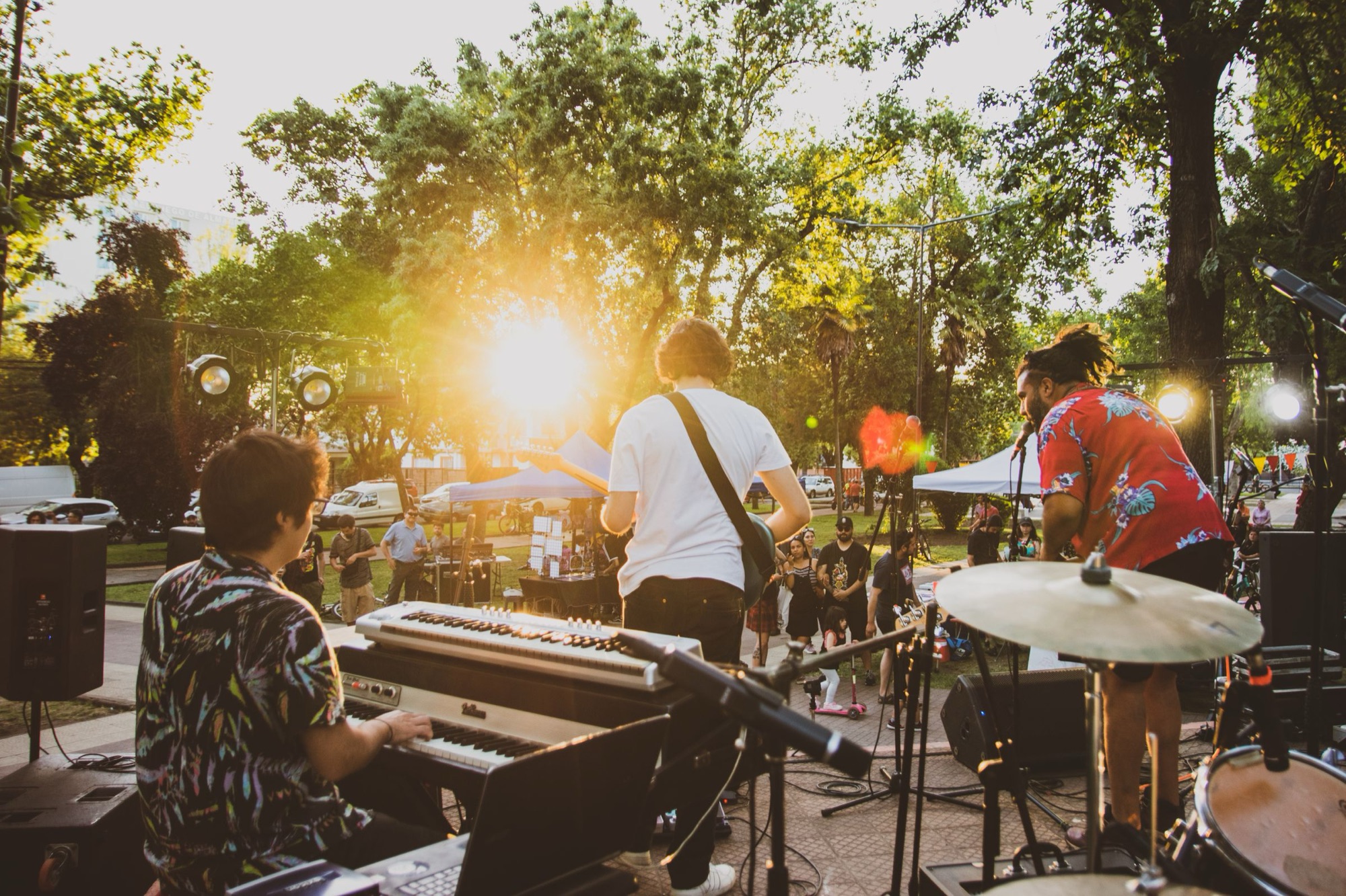 Band performing outdoors at golden hour