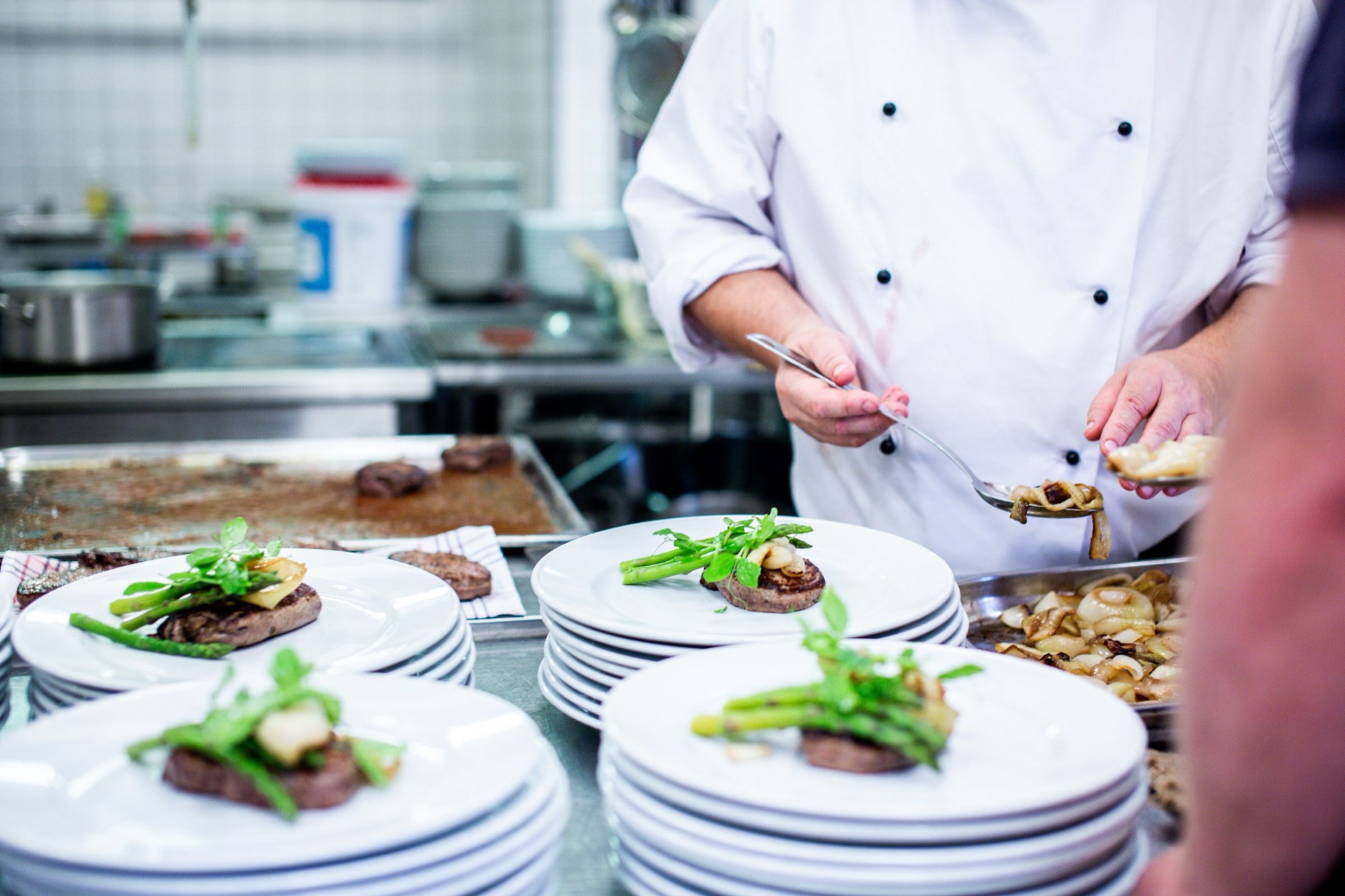 Chefs plating a seated dinner