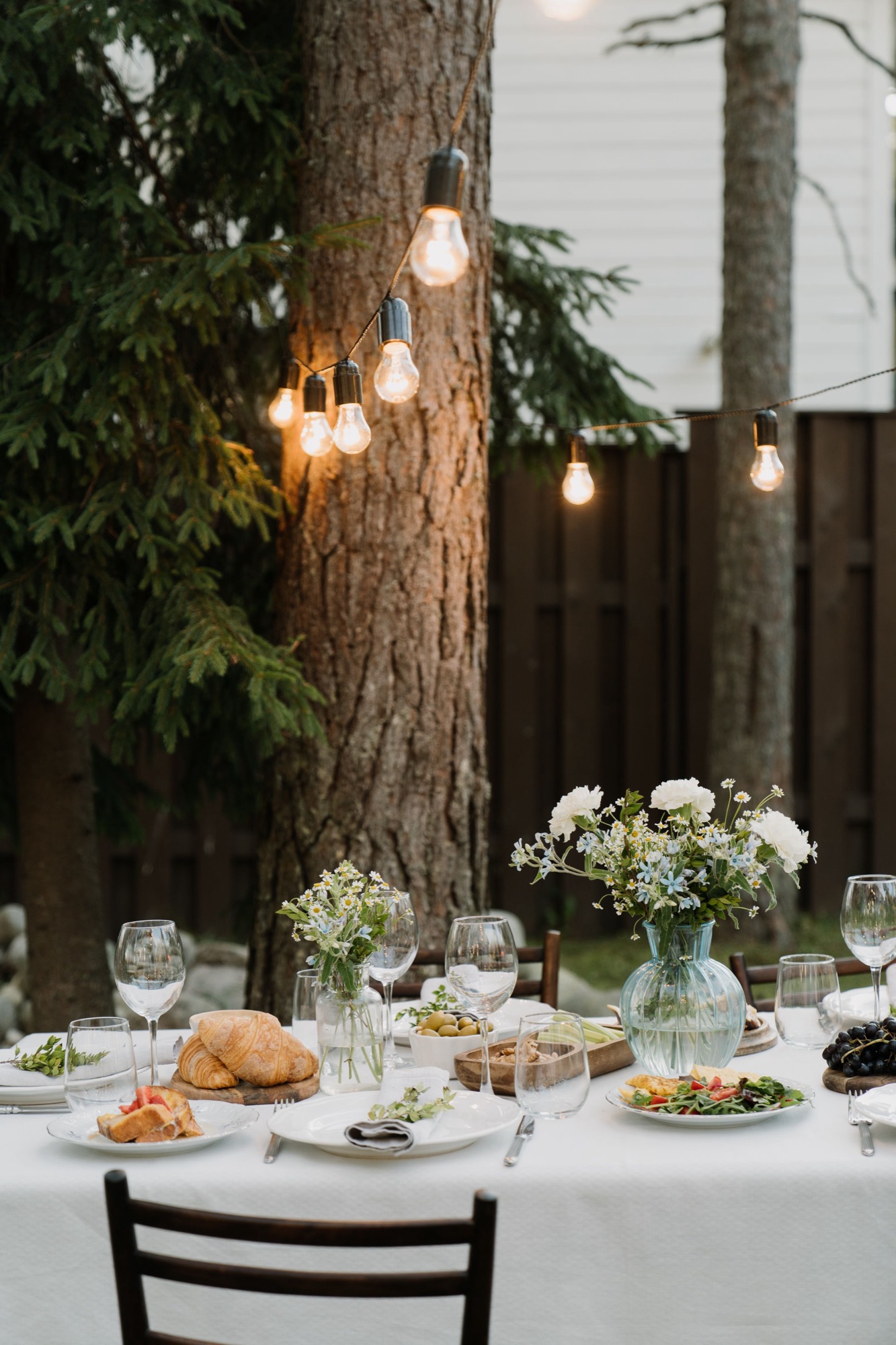 Garden dinner under string lights